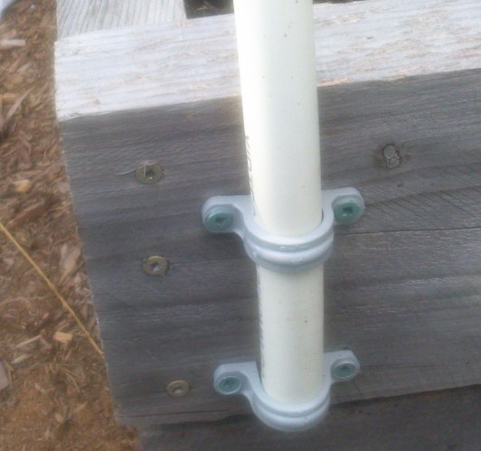 floating row cover attachment with pipe clamps